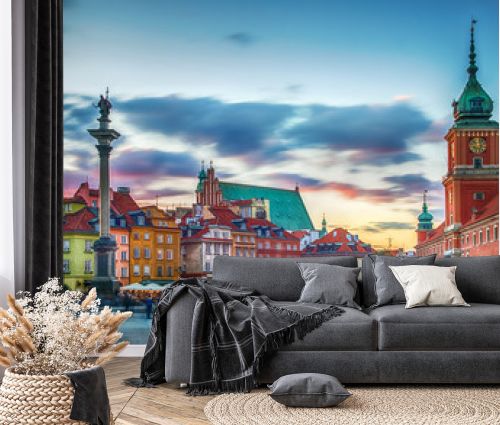 Panoramic view on Royal Castle, ancient townhouses and Sigismund's Column in Old town in Warsaw, Poland. Evening view.