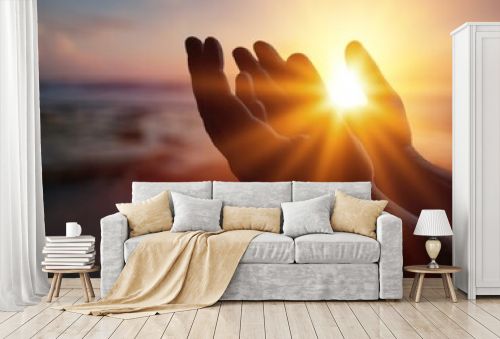 Silhouette person on sunset background. Raising his hands in worship. Christian Religion concept background.