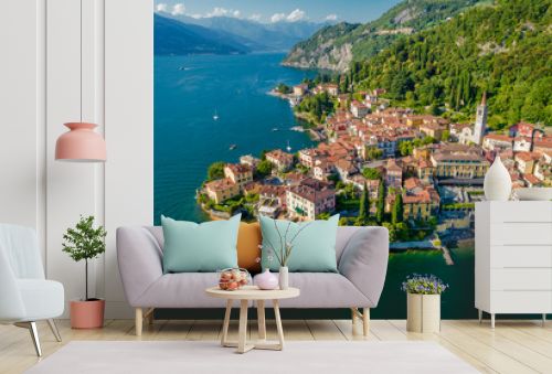 Varenna, Como Lake. Aerial panoramic view of town surrounded by mountains, blue sky and turquoise water and located in Como Lake, Lombardy, Italy