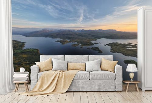 Breathtaking aerial panoramic view of Loch Maree at sunset.
