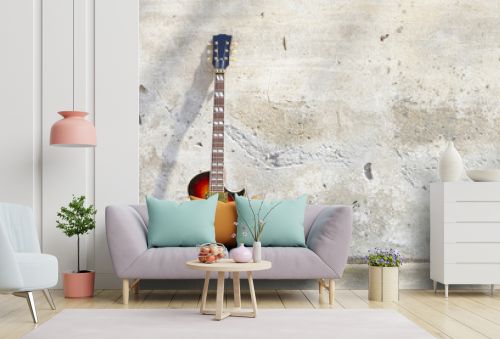 electric guitar in front of a vintage wall