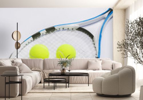 Tennis racket and three green balls on white background.