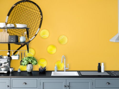 Tennis racket with balls isolated on yellow