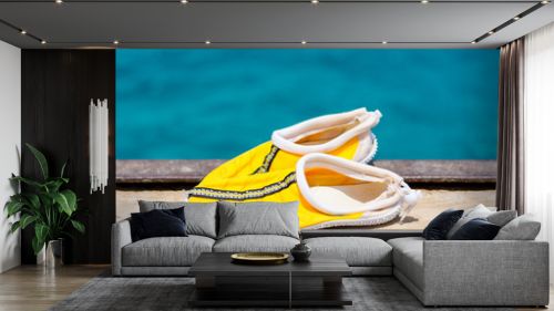 Slippers for corals on the background of the sea