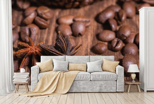 Background for coffee beans in dark colors for the background. Coffee Coffee Beans Cinnamon Stick Anise Star Wooden Table Close-up.