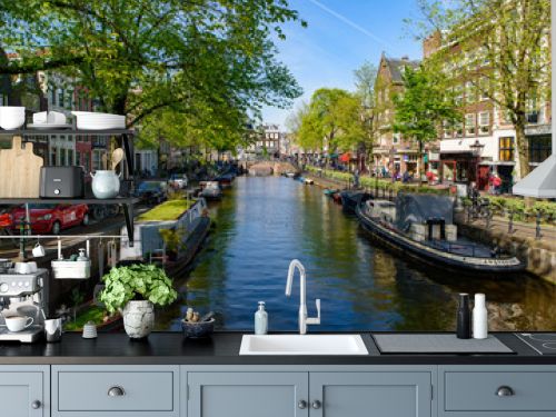 Buildings and boats along the canal in Amsterdam, Netherlands