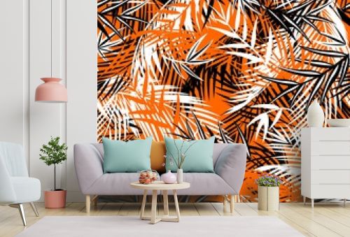 Seamless orange background with black and white coconut and fan-leaved palm leaves. Tropical print for fashion textile and wallpaper