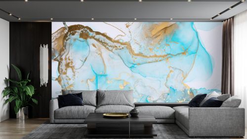 Luxurious abstract fluid painting in alcohol ink technique, mixture of blue and gold paints. Imitation of marble stone,