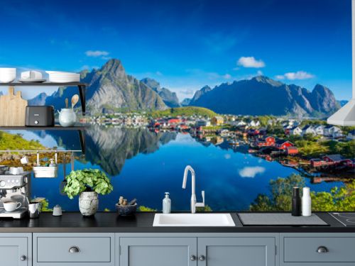 Perfect reflection of the Reine village on the water of the fjord in the Lofoten Islands, Norway