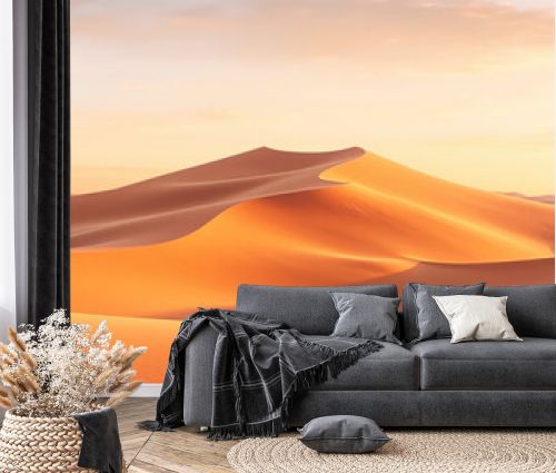 Panorama banner of sand dunes desert at sunset. Endless dunes of yellow sand