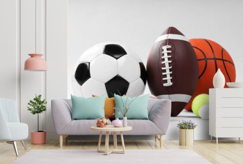 Many different sports balls on light gray background