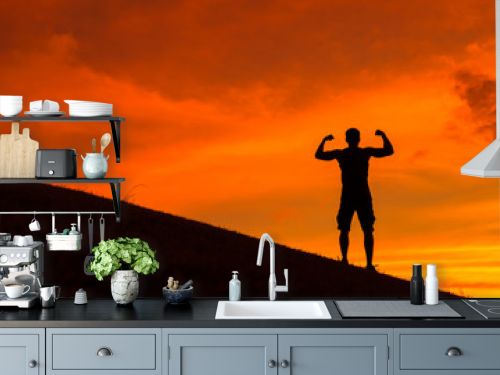 Silhouette of strong and confident man flexing. 