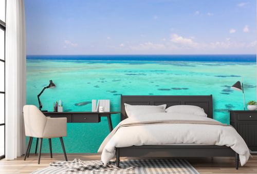 Sea water with lagoon and reefs, water background. Seascape with clear water. Large atoll with lagoon.