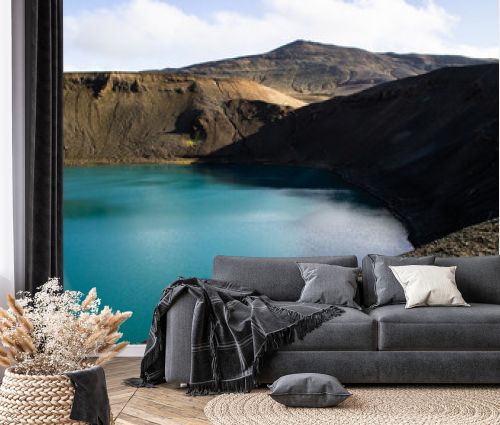 View of Krafla volcano crater with water, tourist popular attraction in Lake Myvatn, Iceland
