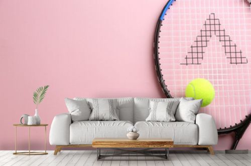 Tennis racket and ball on pink background, top view. Space for text